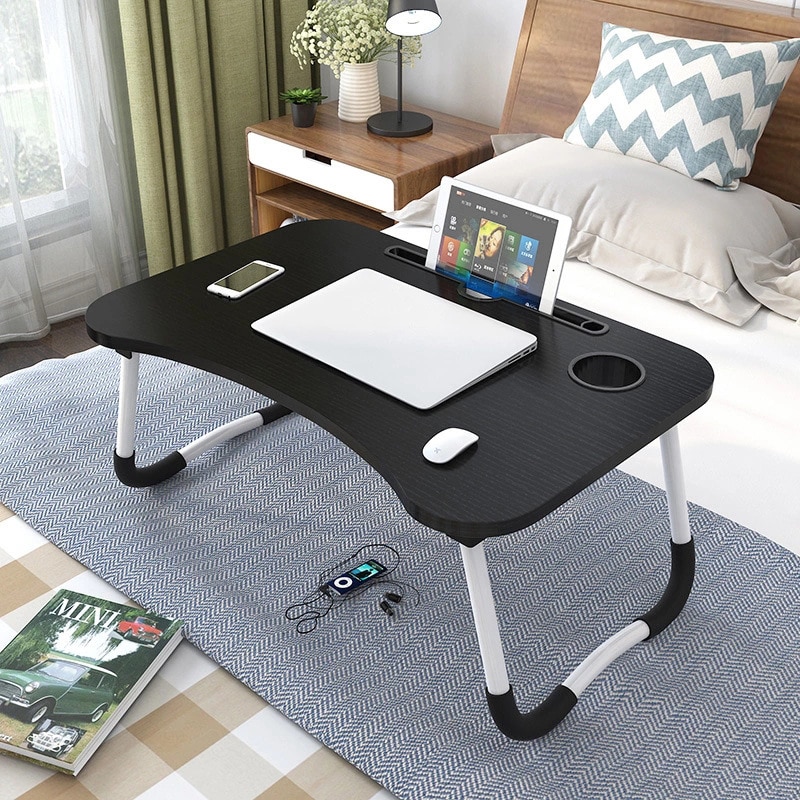 Velmi praktický stolek sloužící především jako podložka pod přenosný počítač.